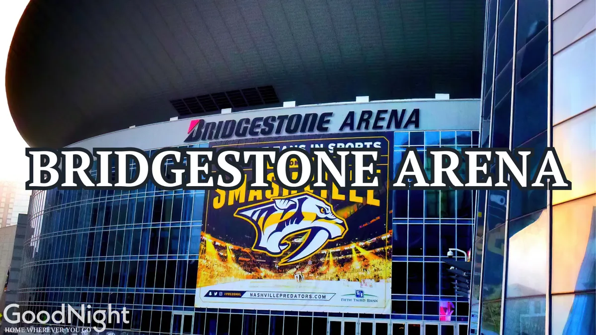 This image features the iconic Bridgestone Arena, with its glass facade and large banner displaying the Nashville Predators logo. The scene is lively and vibrant, hinting at the excitement of attending sports events, concerts, and major gatherings in the heart of downtown Nashville.
